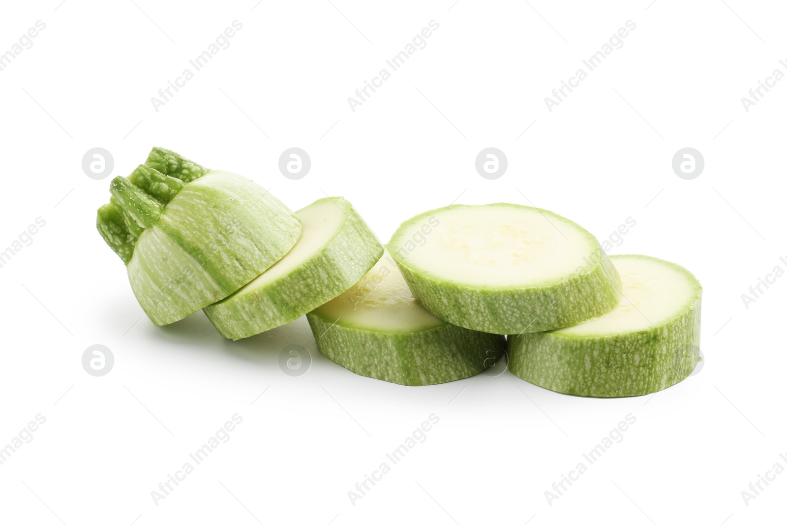 Slices of fresh zucchini isolated on white Photo of Slices of fresh zucchini isolated on white