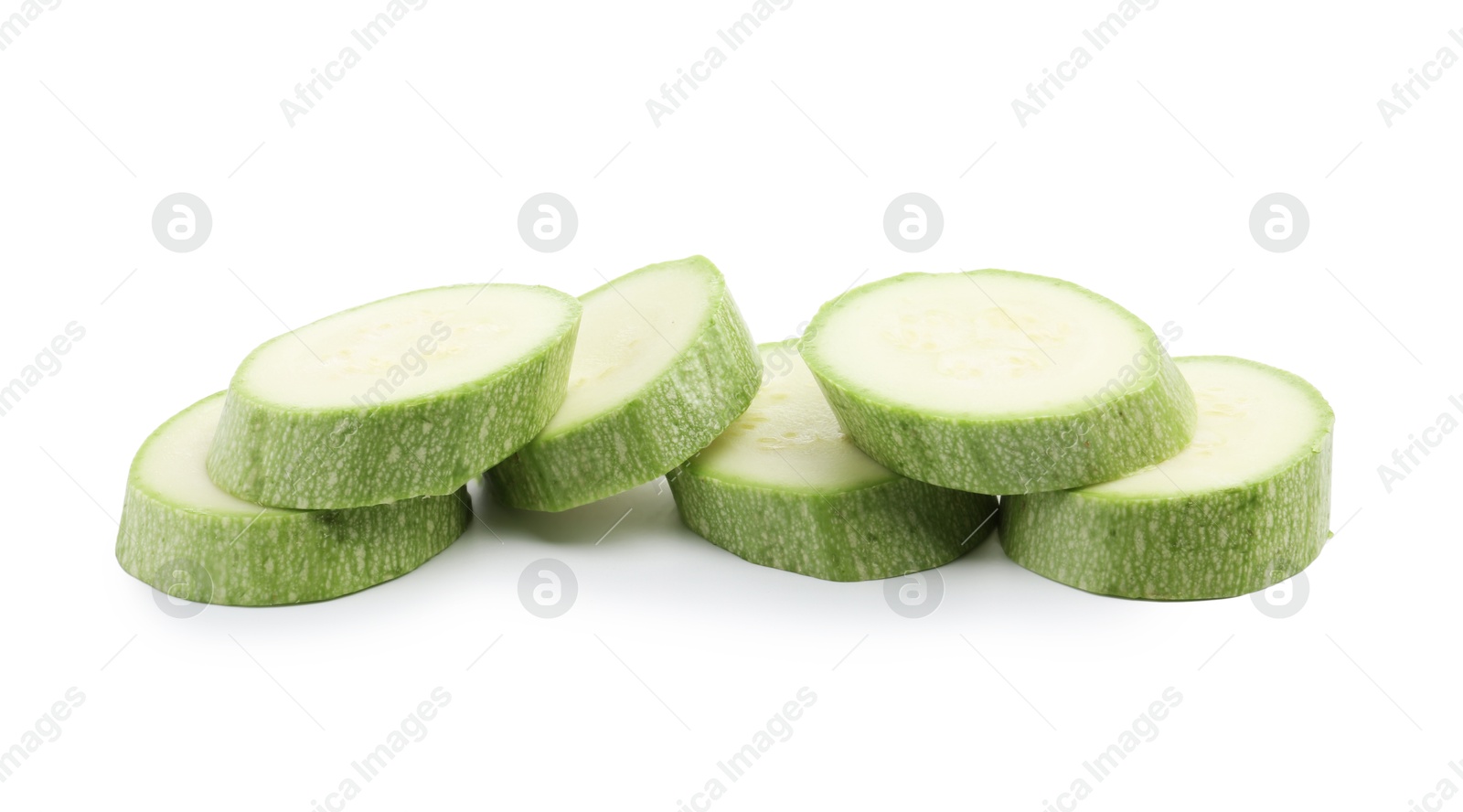Slices of fresh zucchini isolated on white Photo of Slices of fresh zucchini isolated on white