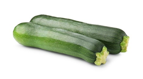 Photo of Two fresh ripe zucchinis isolated on white