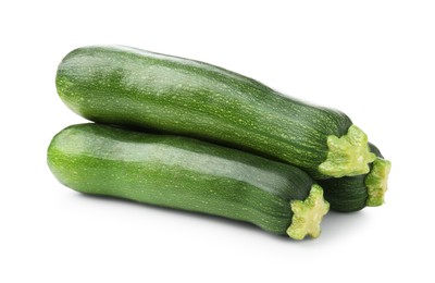 Photo of Three fresh ripe zucchinis isolated on white