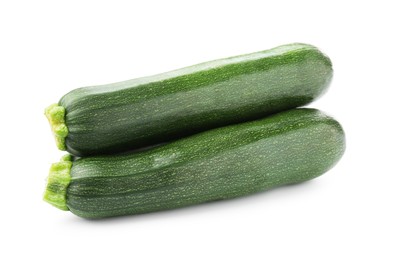 Photo of Three fresh ripe zucchinis isolated on white