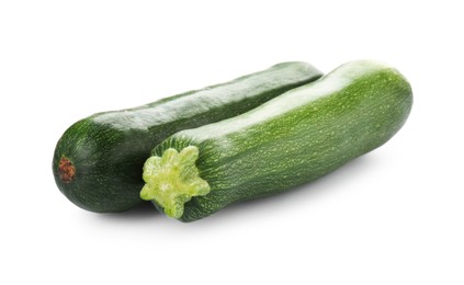 Photo of Two fresh ripe zucchinis isolated on white