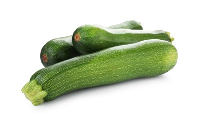 Photo of Three fresh ripe zucchinis isolated on white