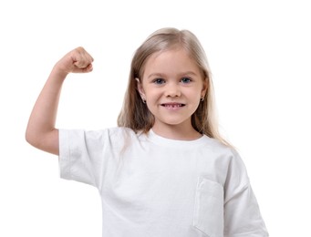 Photo of Strength. Happy little girl showing her biceps on white background