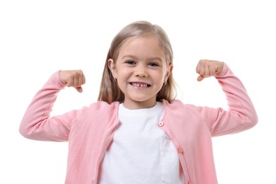 Photo of Strength. Happy little girl showing her biceps on white background