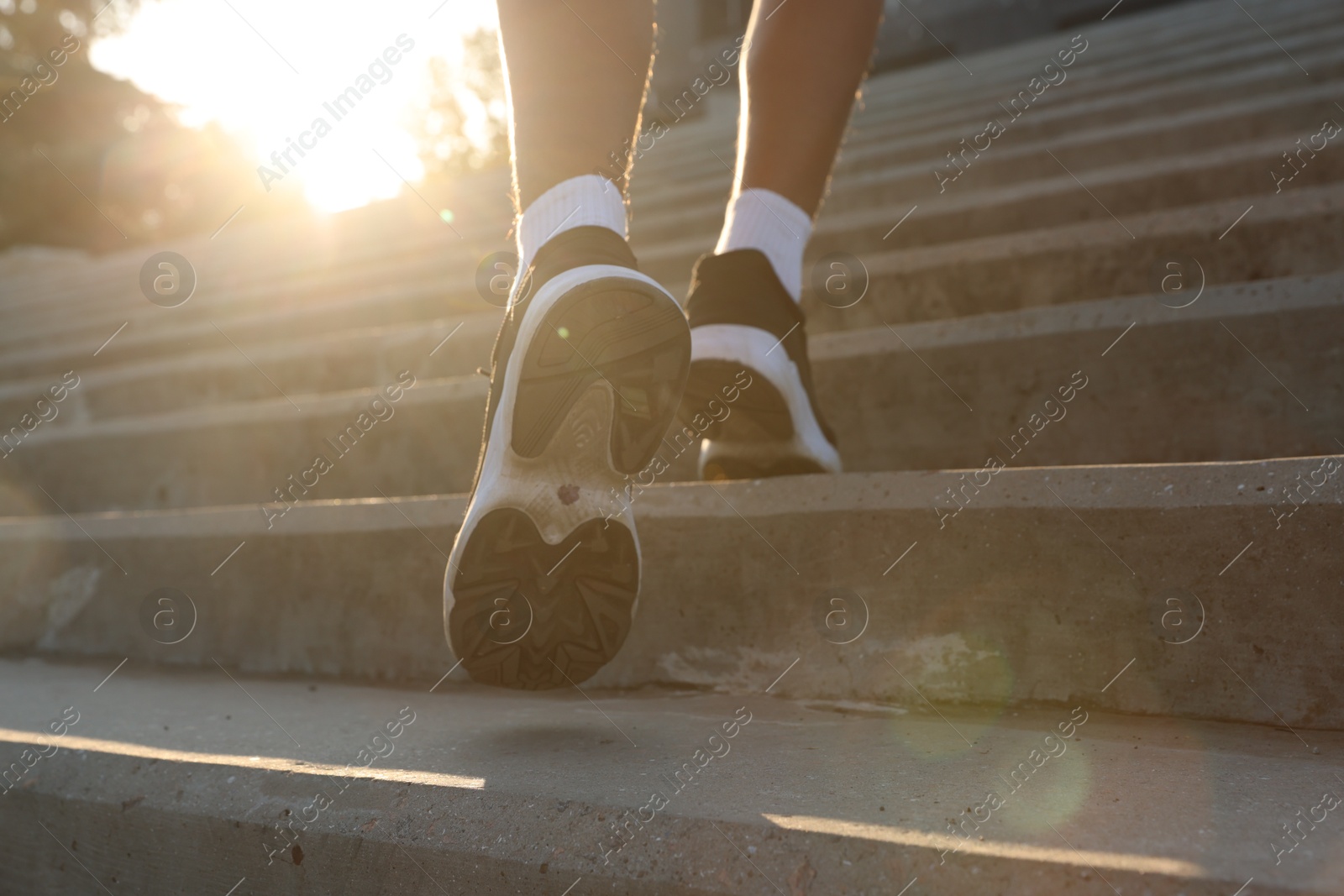 Teenage boy running up stairs outdoors, closeup Photo of Teenage boy running up stairs outdoors, closeup