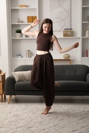 Photo of Portrait of beautiful young woman at home