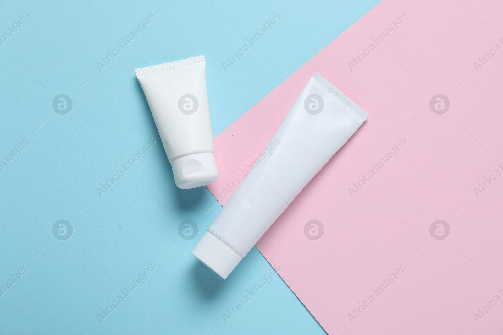 Cosmetic products on color background, flat lay. Mockup for design Photo of Cosmetic products on color background, flat lay. Mockup for design