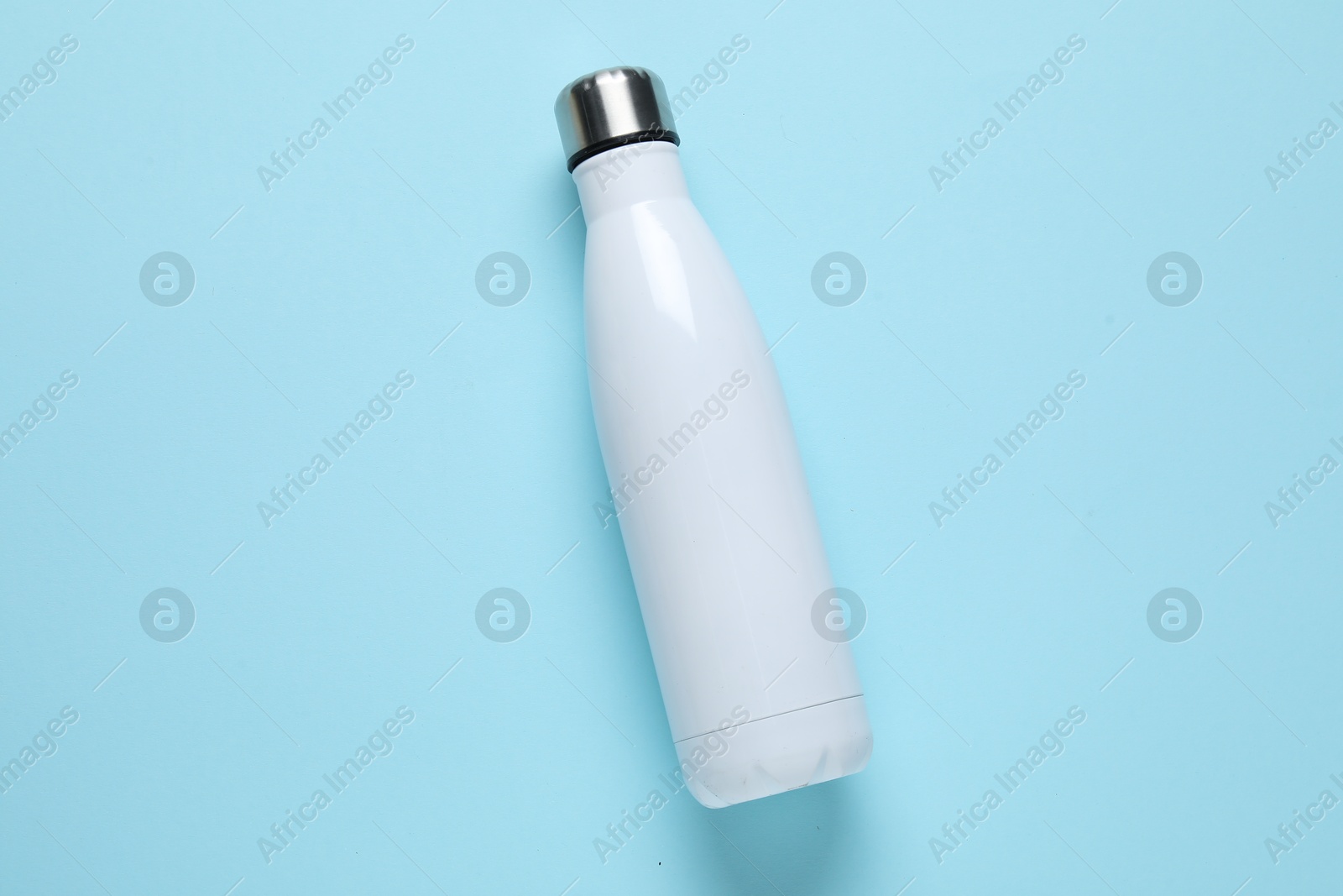 Water bottle on light blue background, top view Photo of Water bottle on light blue background, top view