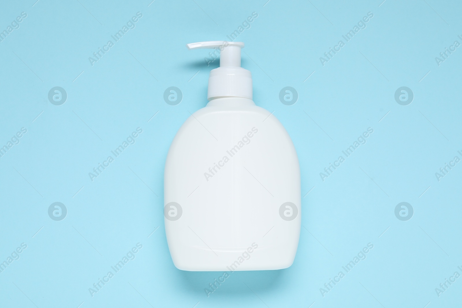 Cosmetic product on light blue background, top view. Mockup for design Photo of Cosmetic product on light blue background, top view. Mockup for design