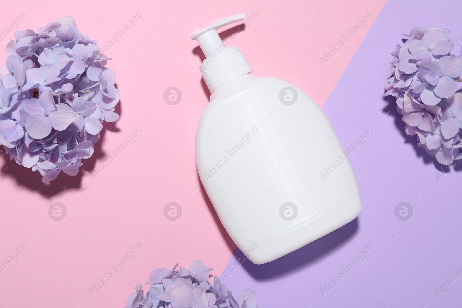 Cosmetic product and flowers on color background, flat lay. Mockup for design Photo of Cosmetic product and flowers on color background, flat lay. Mockup for design