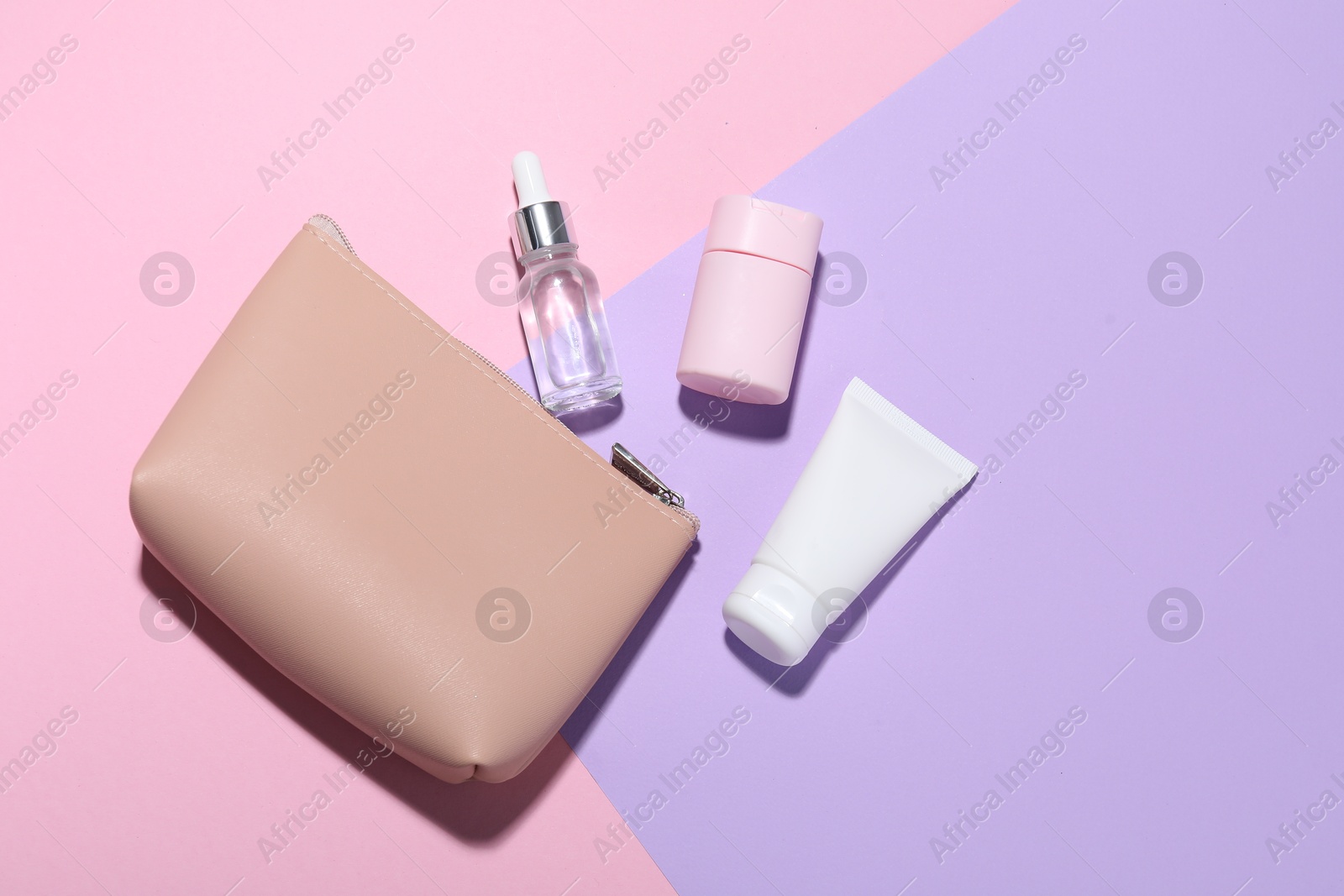 Bag with cosmetic products on color background, flat lay. Mockup for design Photo of Bag with cosmetic products on color background, flat lay. Mockup for design