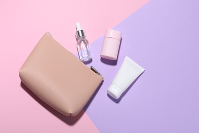 Photo of Bag with cosmetic products on color background, flat lay. Mockup for design