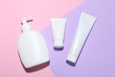 Photo of Cosmetic products on color background, flat lay. Mockup for design