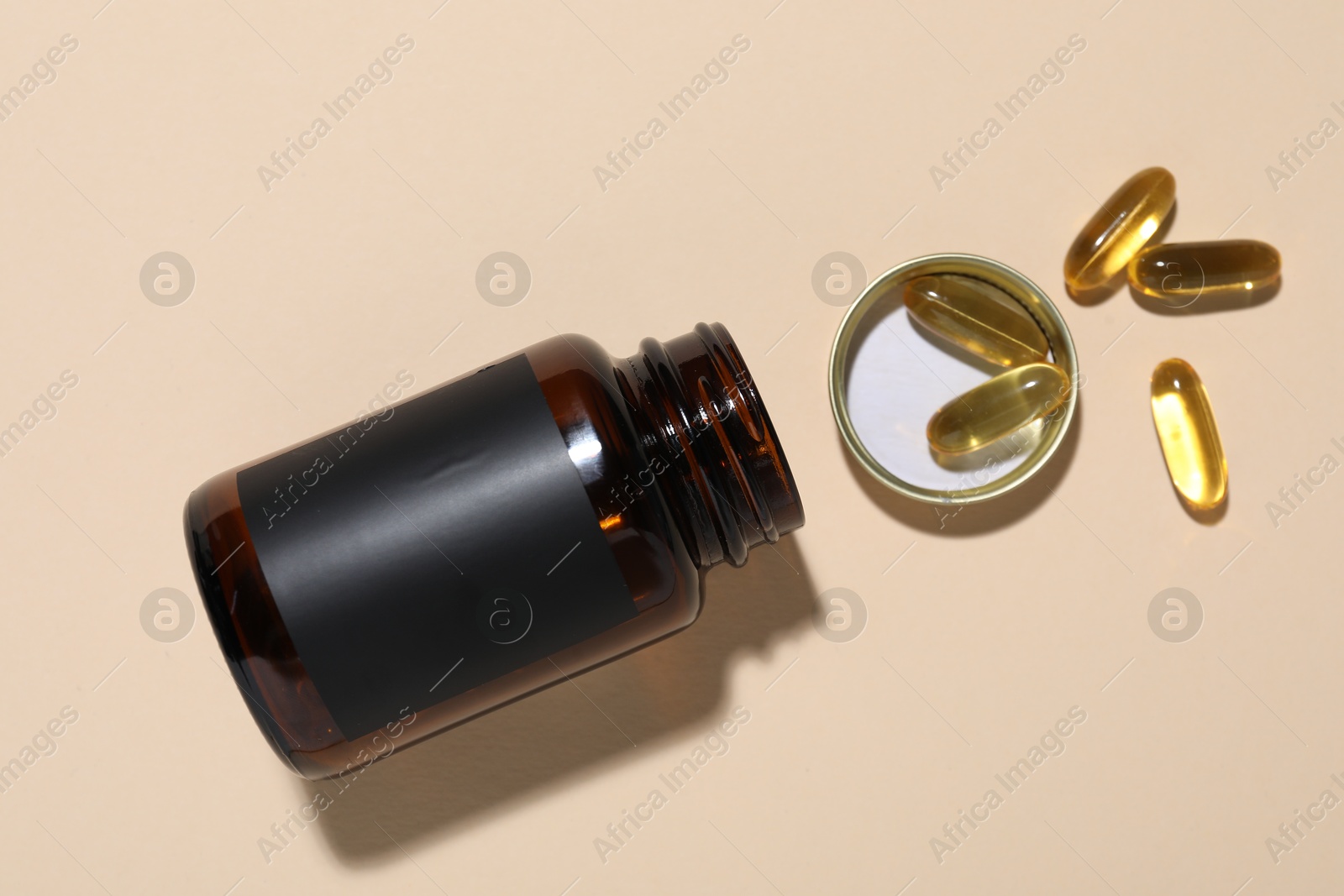 Jar of vitamins on beige background, top view Photo of Jar of vitamins on beige background, top view