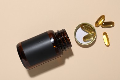 Photo of Jar of vitamins on beige background, top view