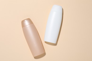 Photo of Cosmetic products on beige background, flat lay. Mockup for design