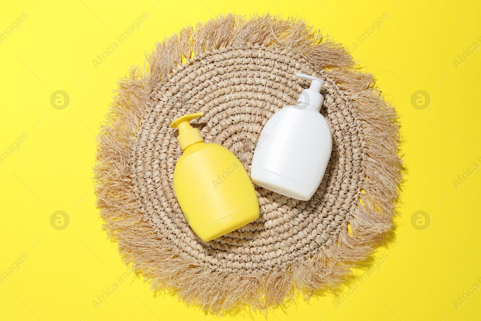 Cosmetic products and wicker mat on yellow background, flat lay. Mockup for design Photo of Cosmetic products and wicker mat on yellow background, flat lay. Mockup for design