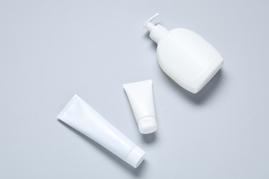 Photo of Cosmetic products on light background, flat lay. Mockup for design