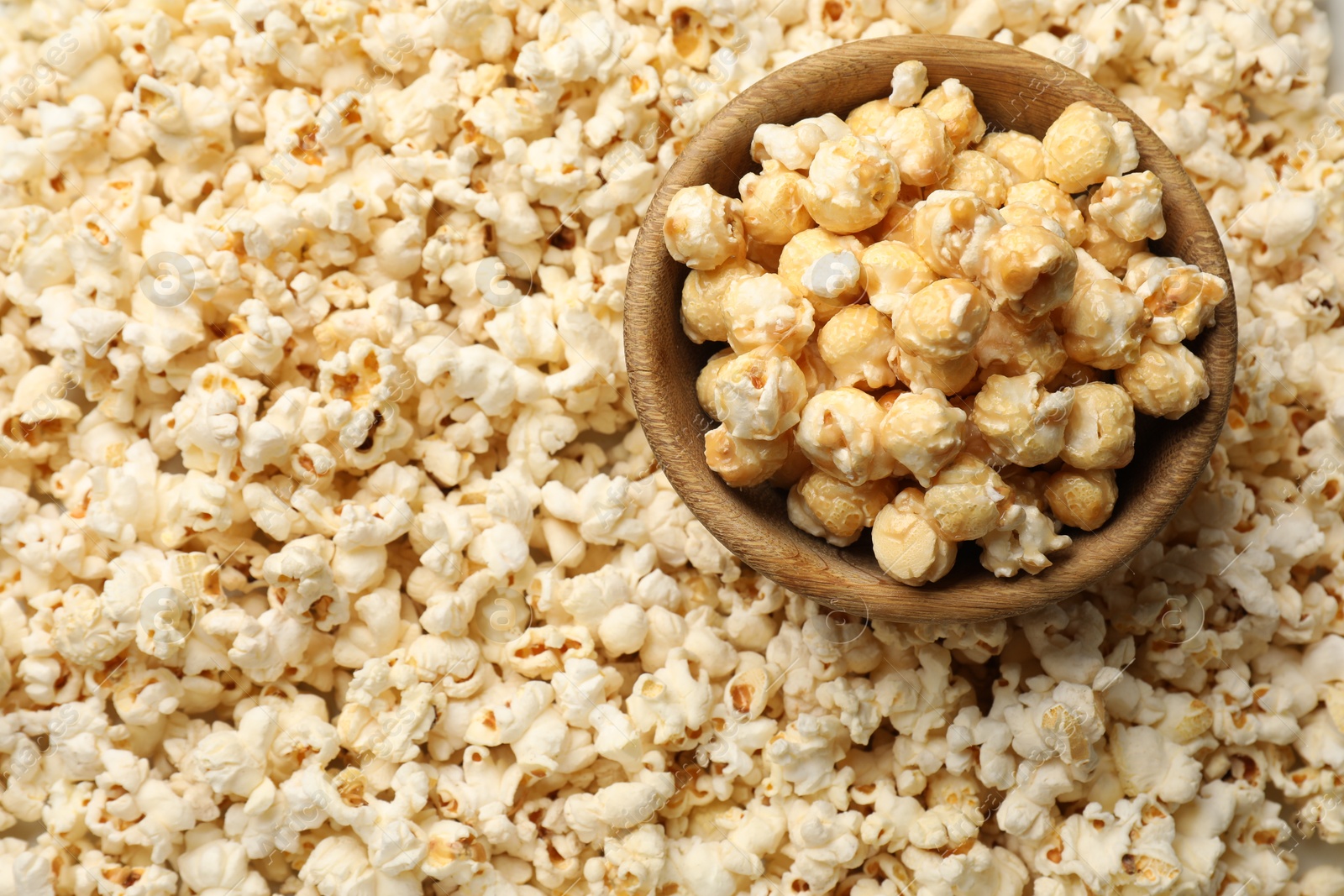 Tasty popcorn and bowl as background, closeup Photo of Tasty popcorn and bowl as background, closeup
