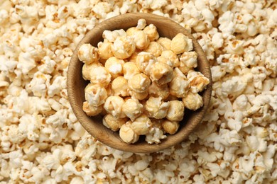 Photo of Tasty popcorn and bowl as background, closeup