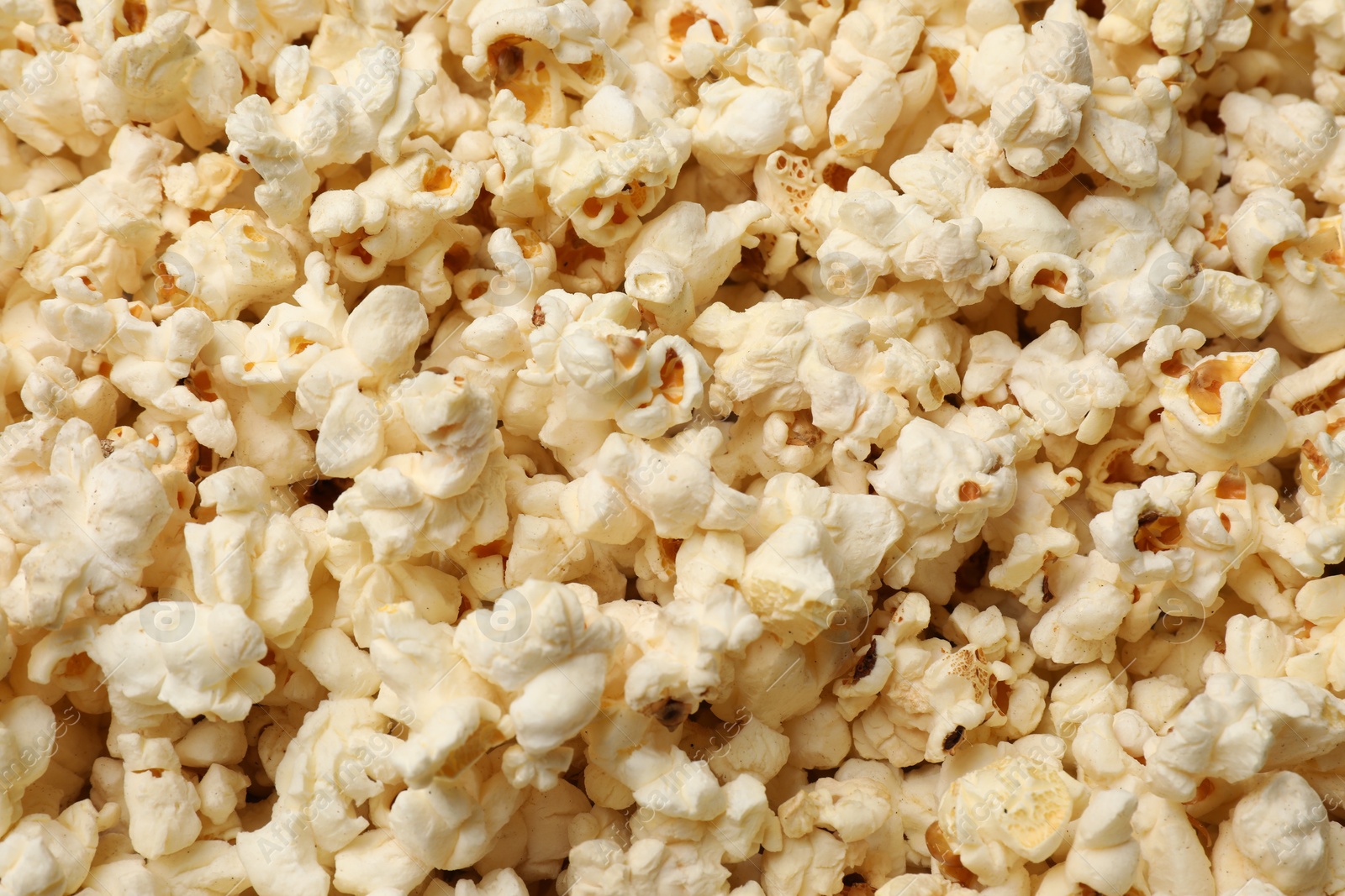 Fresh tasty popcorn as background, closeup view Photo of Fresh tasty popcorn as background, closeup view