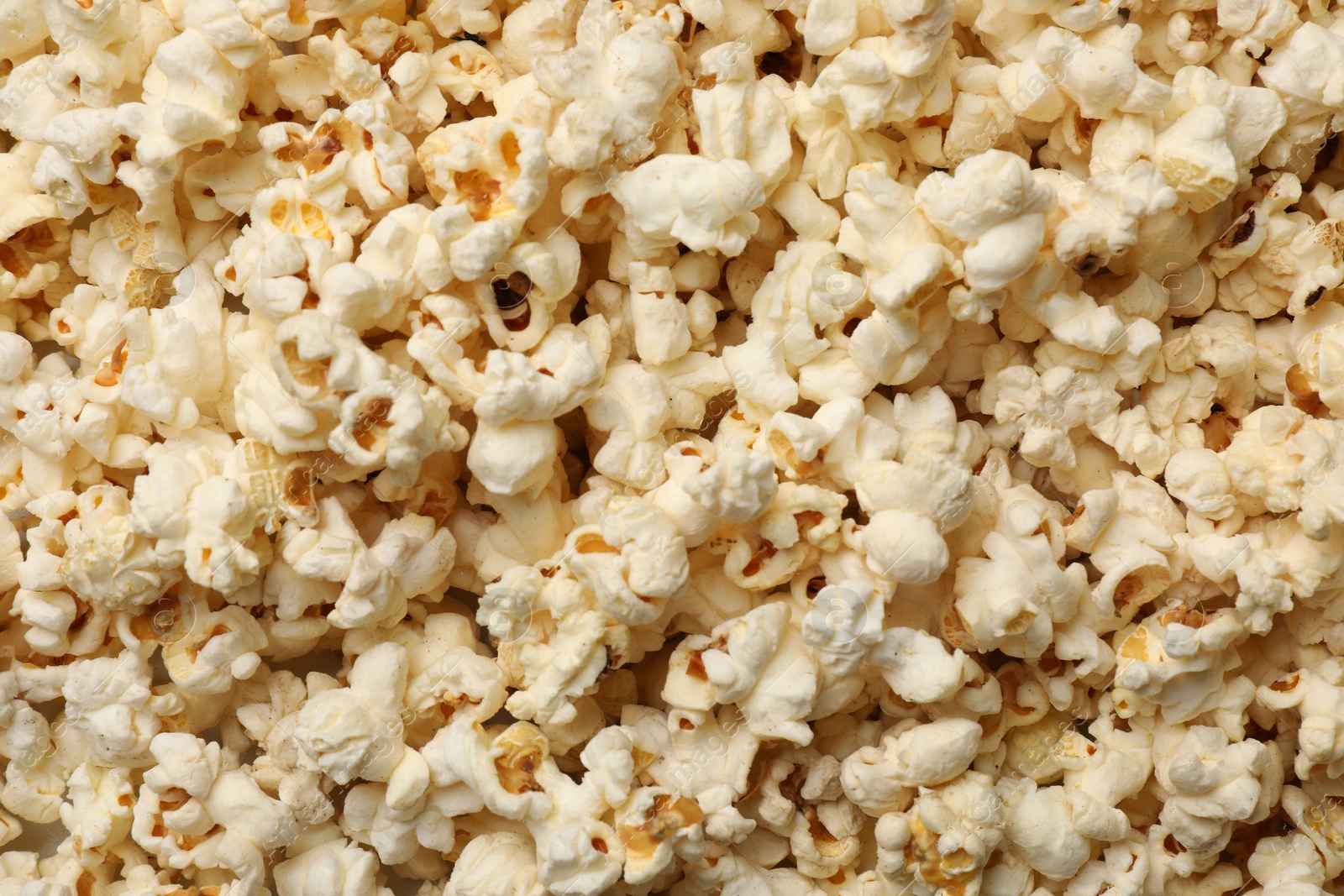Fresh tasty popcorn as background, closeup view Photo of Fresh tasty popcorn as background, closeup view