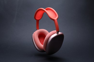 Photo of Pair of wireless headphones on grey background