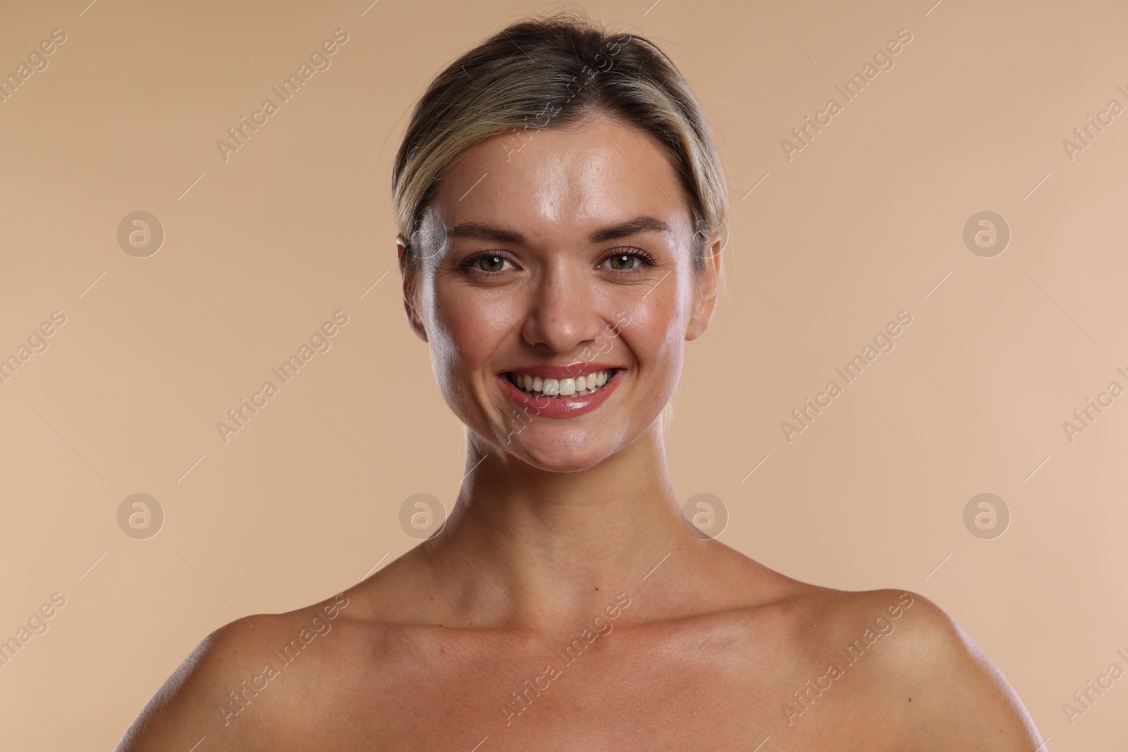 Photo of Woman with beautiful healthy teeth on beige background