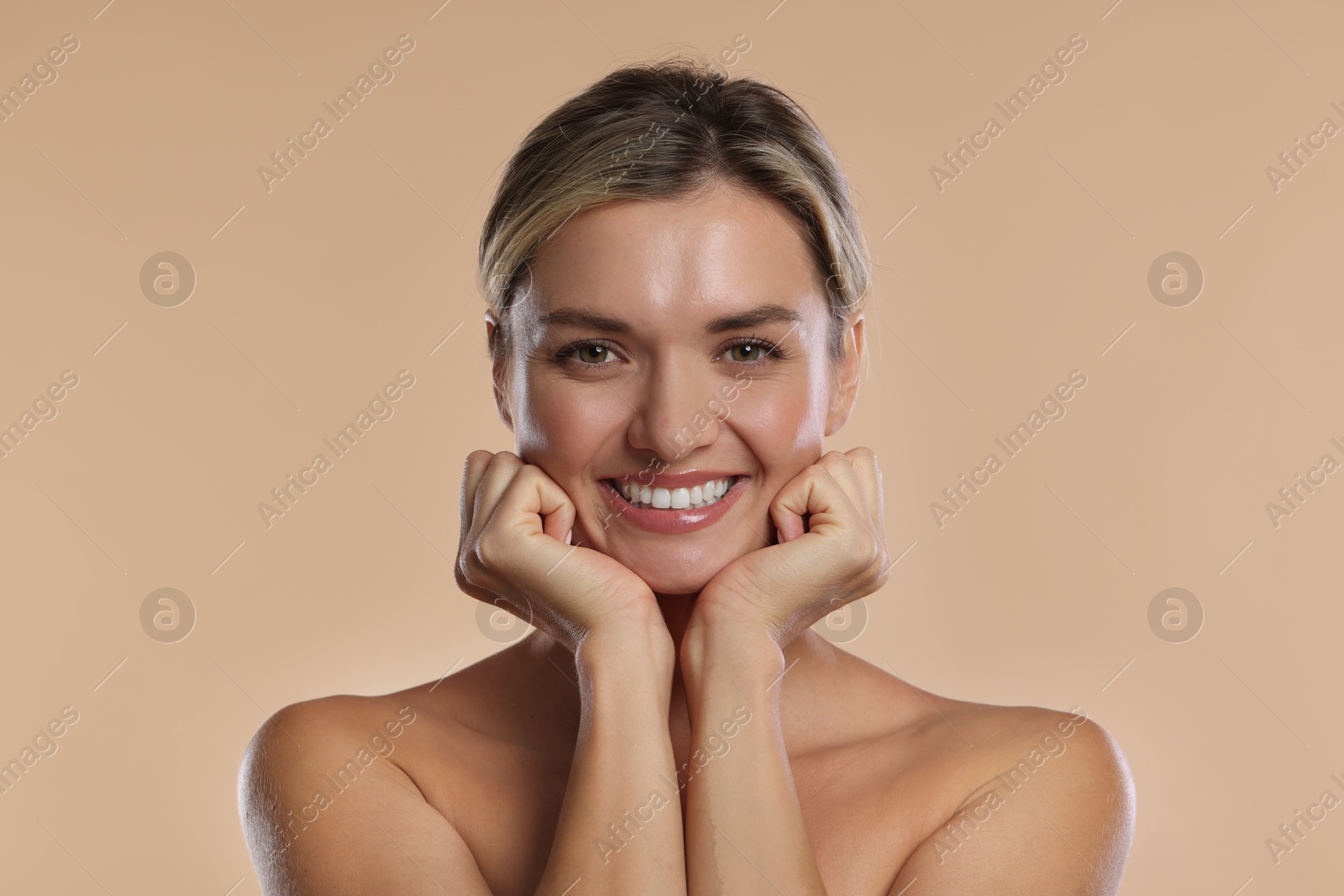 Photo of Woman with beautiful healthy teeth on beige background