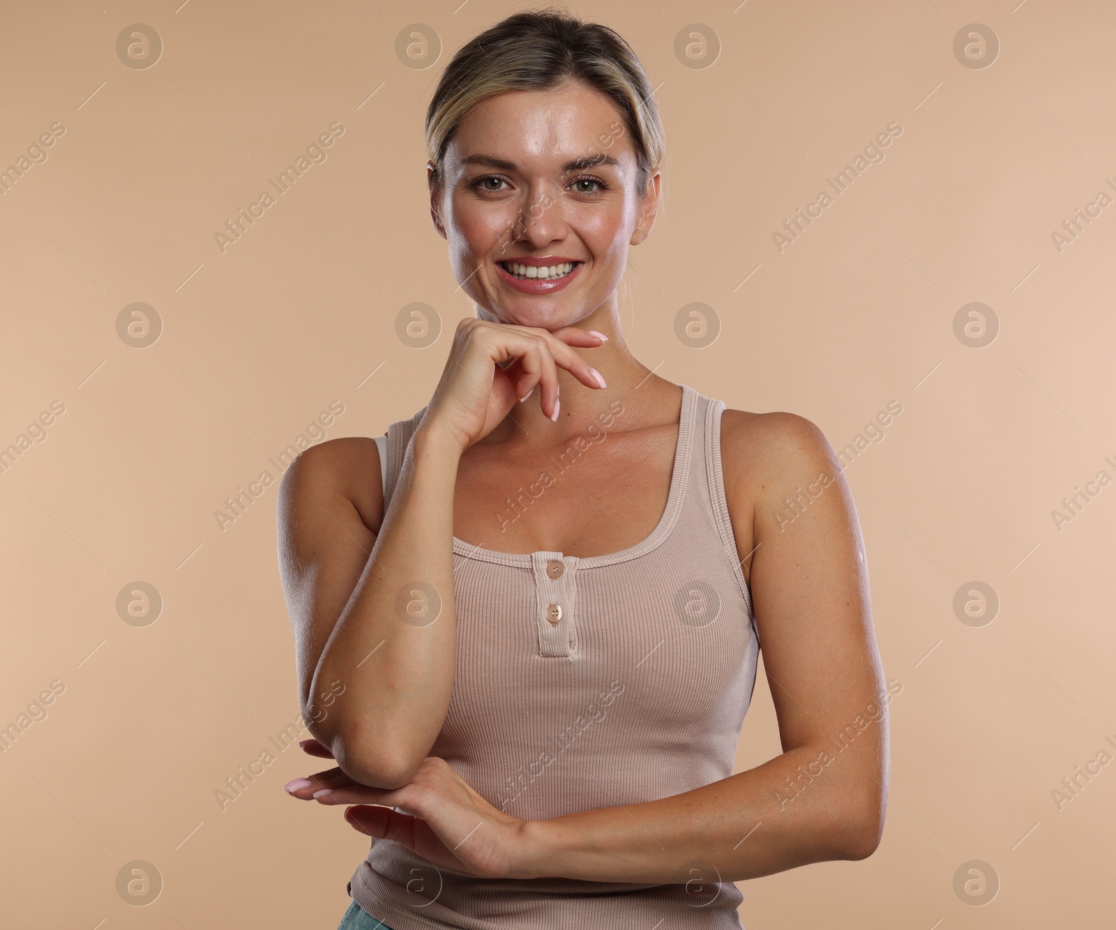 Photo of Woman with beautiful healthy teeth on beige background