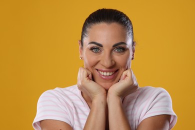 Photo of Woman with beautiful healthy teeth on yellow background