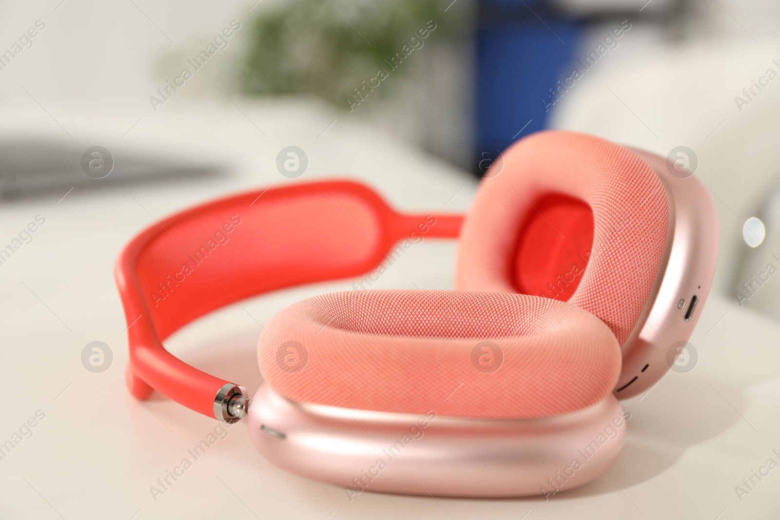 Wireless headphones on white background indoors, closeup Photo of Wireless headphones on white background indoors, closeup
