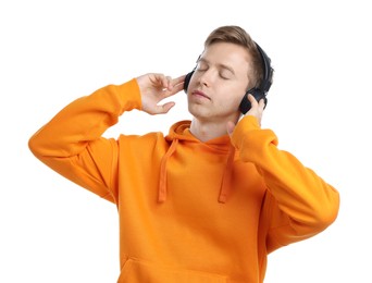 Photo of Young man listening to music in headphones on white background