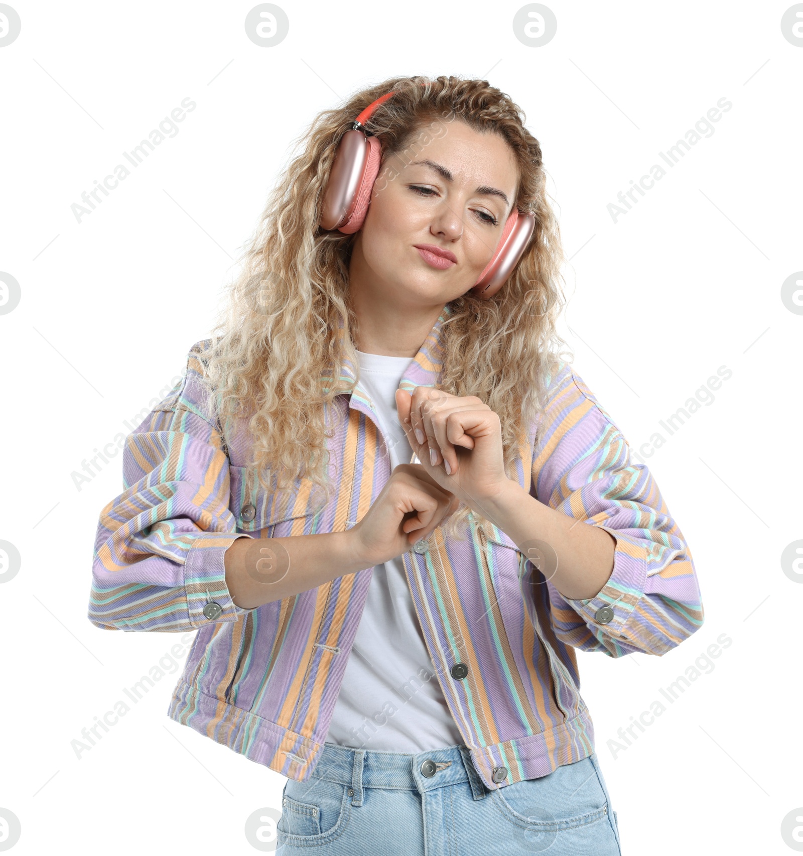 Beautiful woman listening to music in headphones and dancing on white background Photo of Beautiful woman listening to music in headphones and dancing on white background
