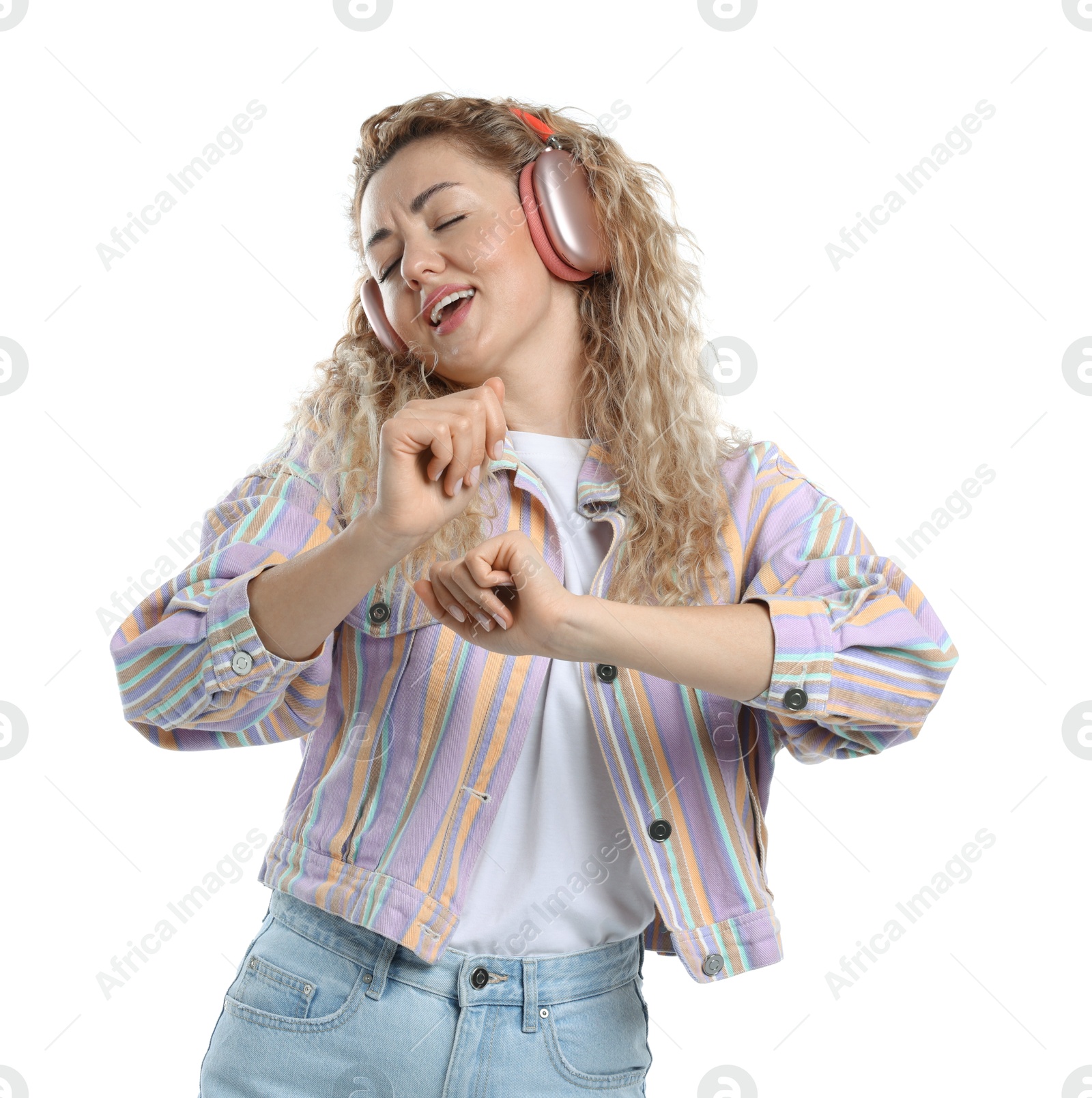 Happy woman listening to music in headphones and dancing on white background Photo of Happy woman listening to music in headphones and dancing on white background