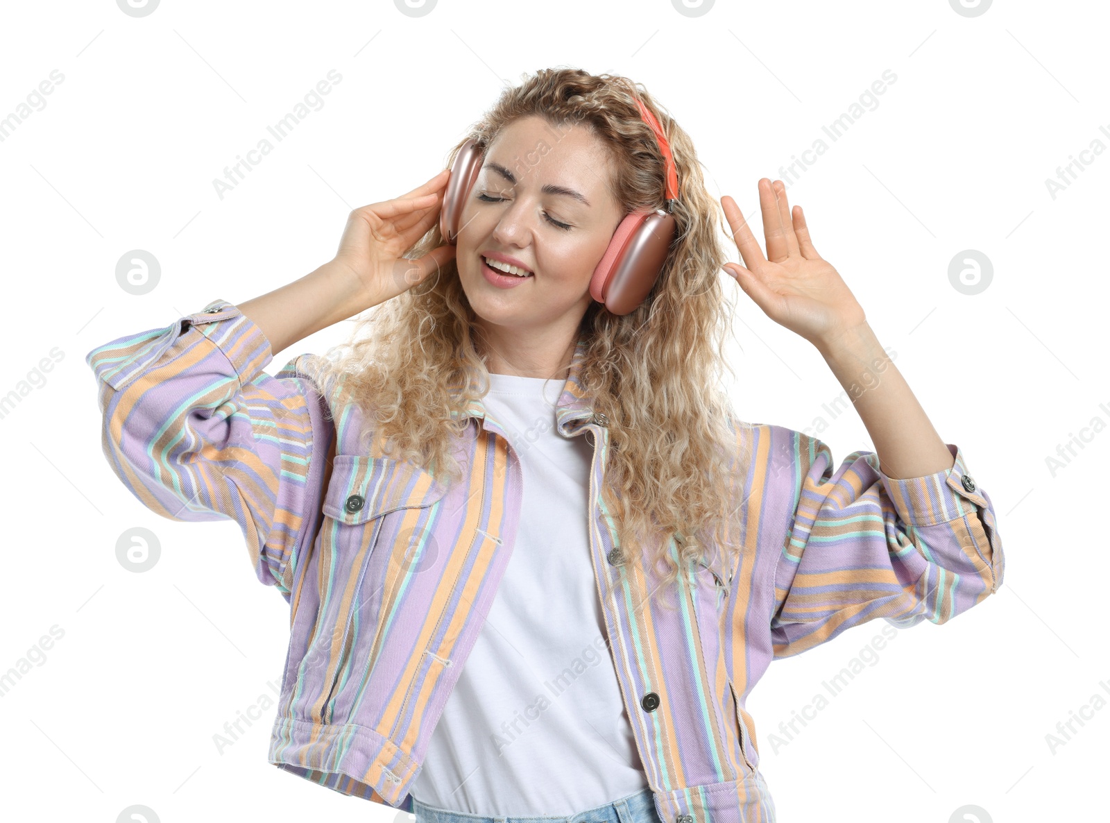 Happy woman listening to music in headphones and dancing on white background Photo of Happy woman listening to music in headphones and dancing on white background