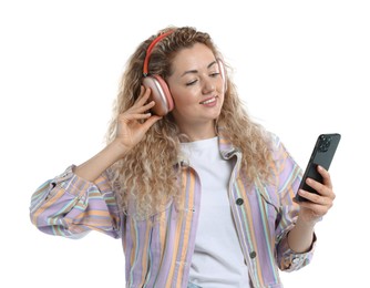 Photo of Happy woman with smartphone listening to music in headphones on white background