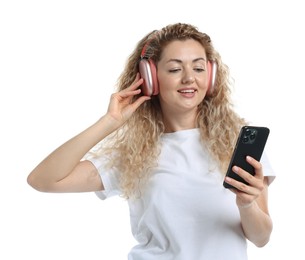 Photo of Happy woman with smartphone listening to music in headphones on white background