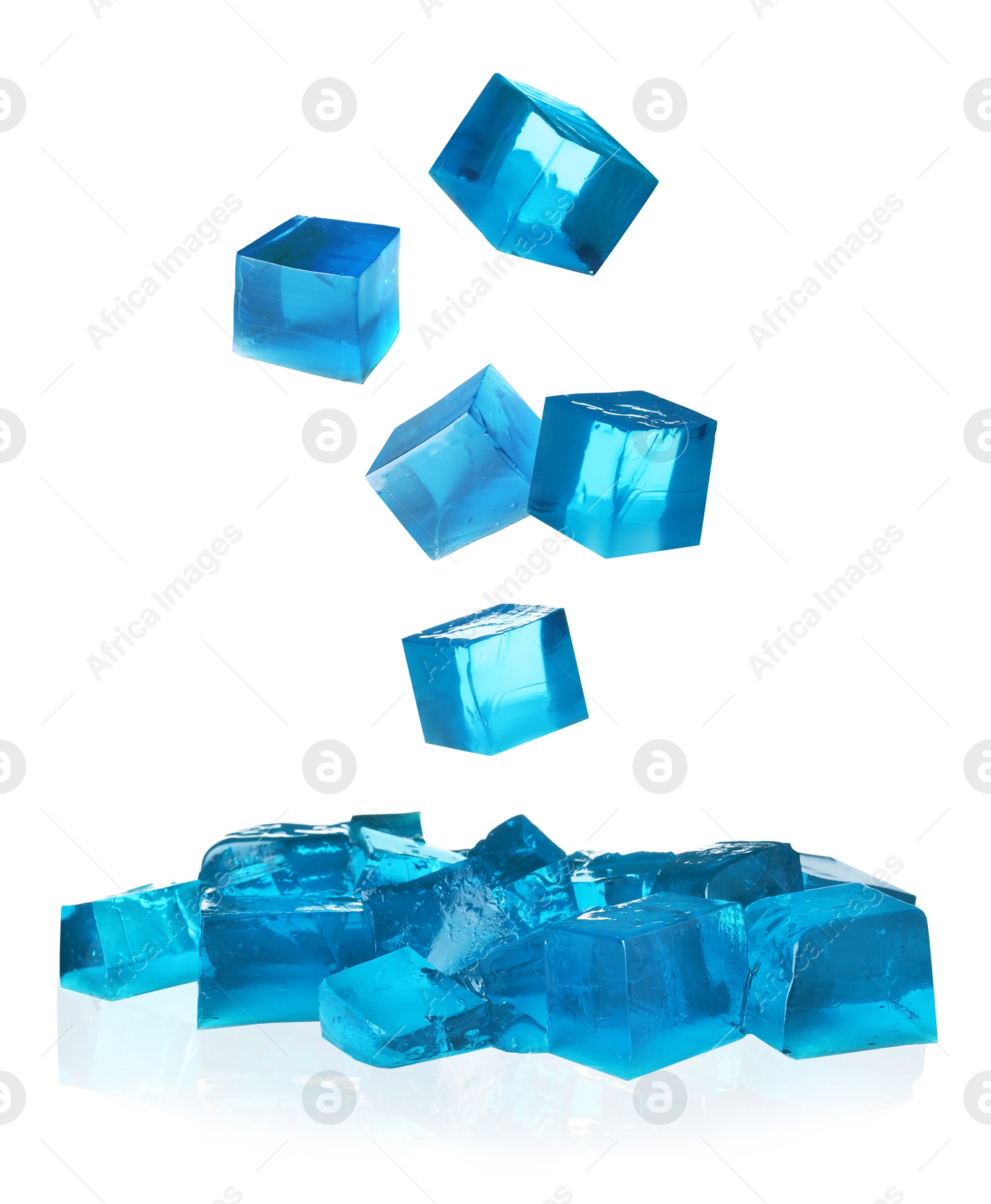 Yummy blue jelly cubes falling on white background Image of Yummy blue jelly cubes falling on white background