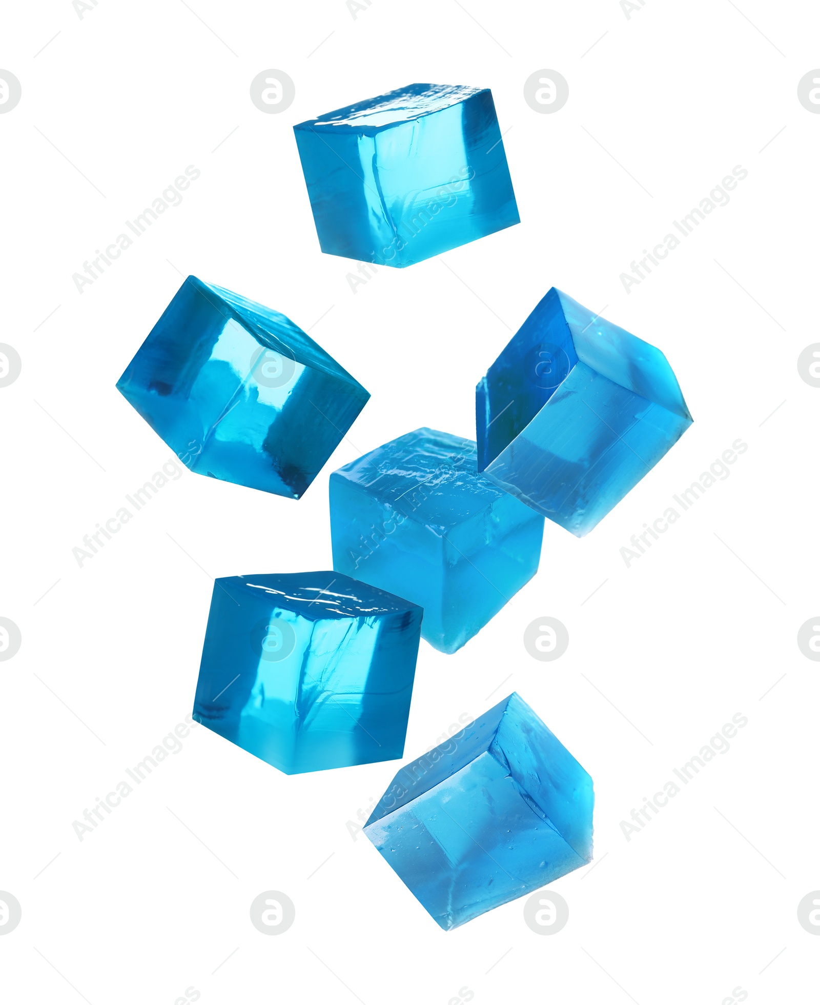 Yummy blue jelly cubes falling on white background Image of Yummy blue jelly cubes falling on white background
