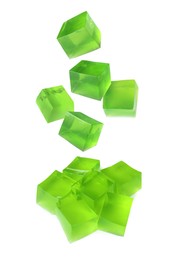Image of Yummy green jelly cubes falling on white background