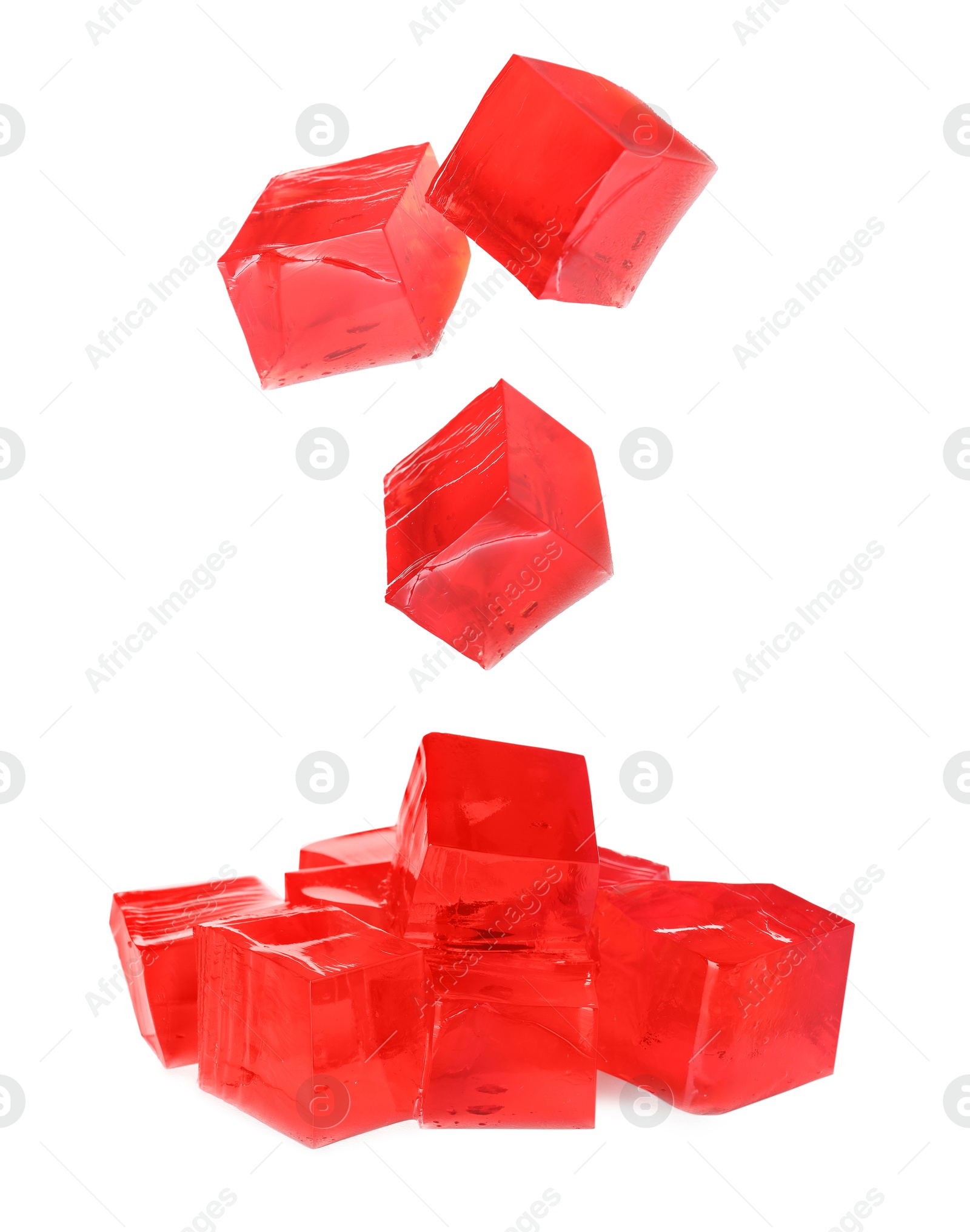 Yummy red jelly cubes falling on white background Image of Yummy red jelly cubes falling on white background