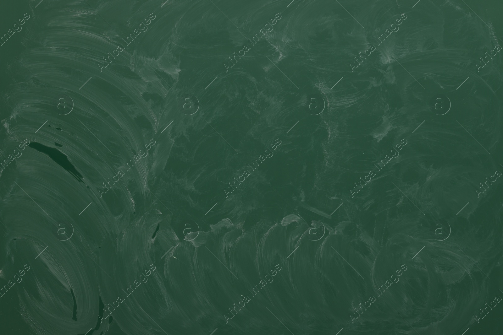 Dirty green chalkboard as background. School equipment Photo of Dirty green chalkboard as background. School equipment