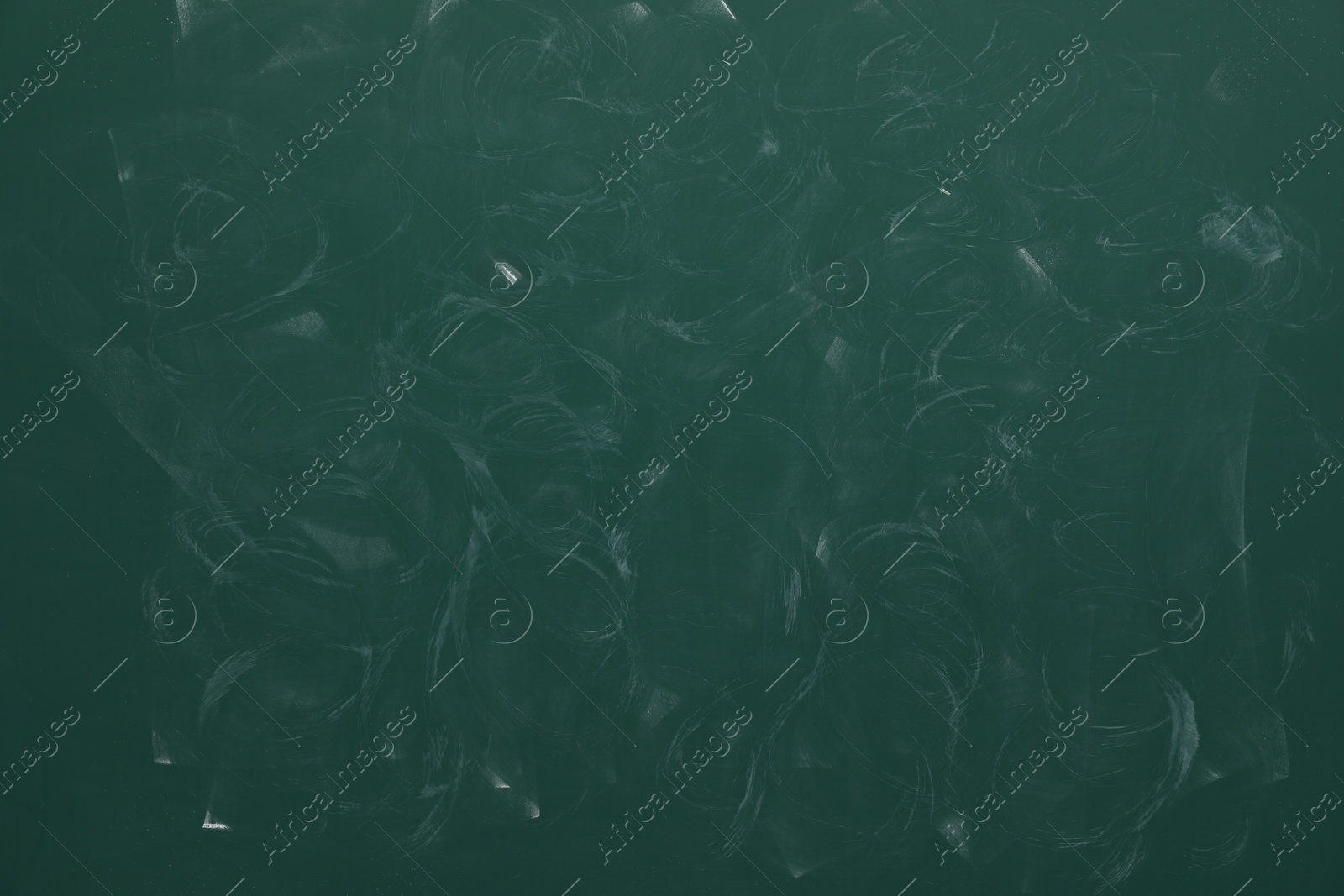 Photo of Dirty green chalkboard as background. School equipment