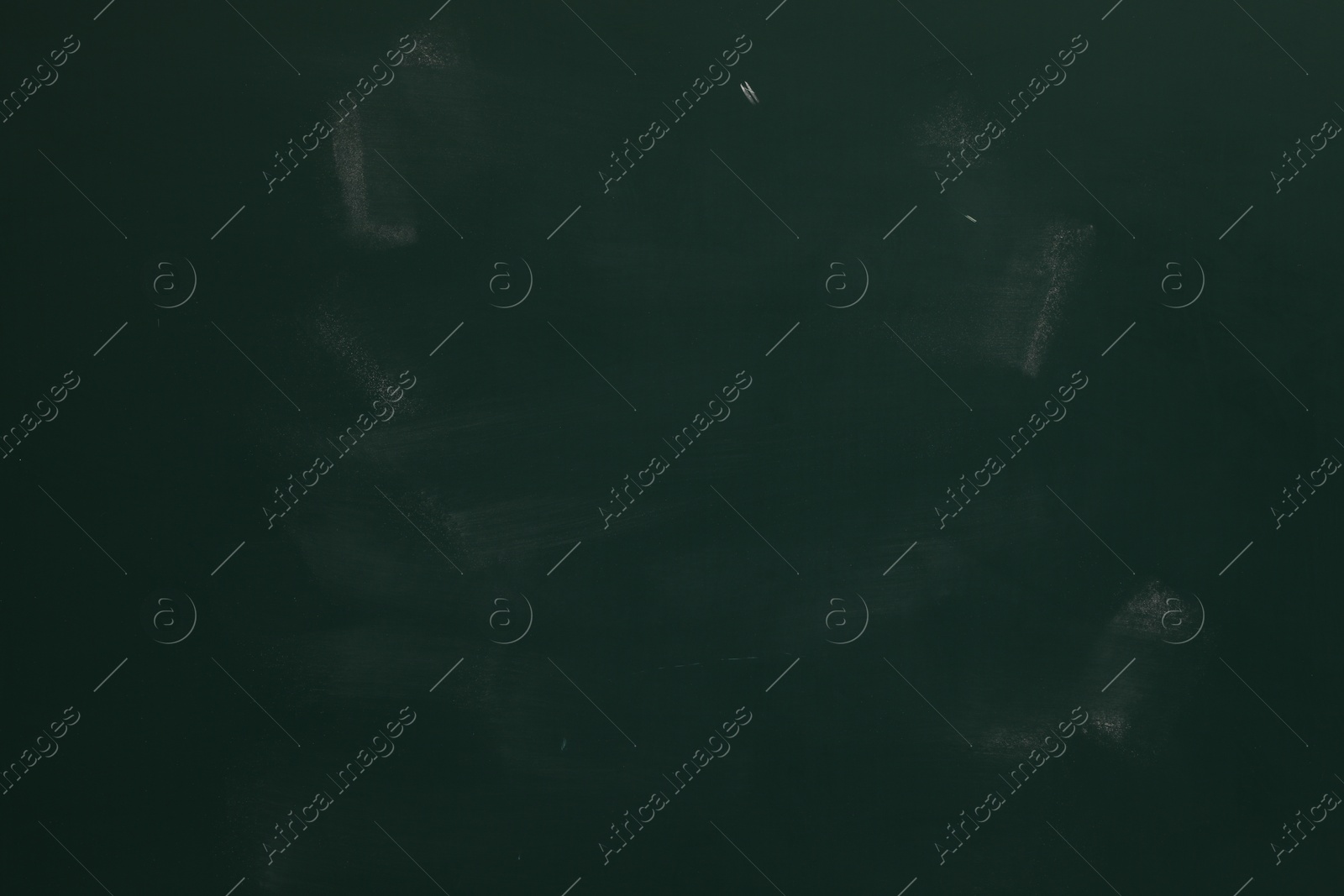 Chalk rubbed out on green chalkboard as background, closeup. Space for text Photo of Chalk rubbed out on green chalkboard as background, closeup. Space for text