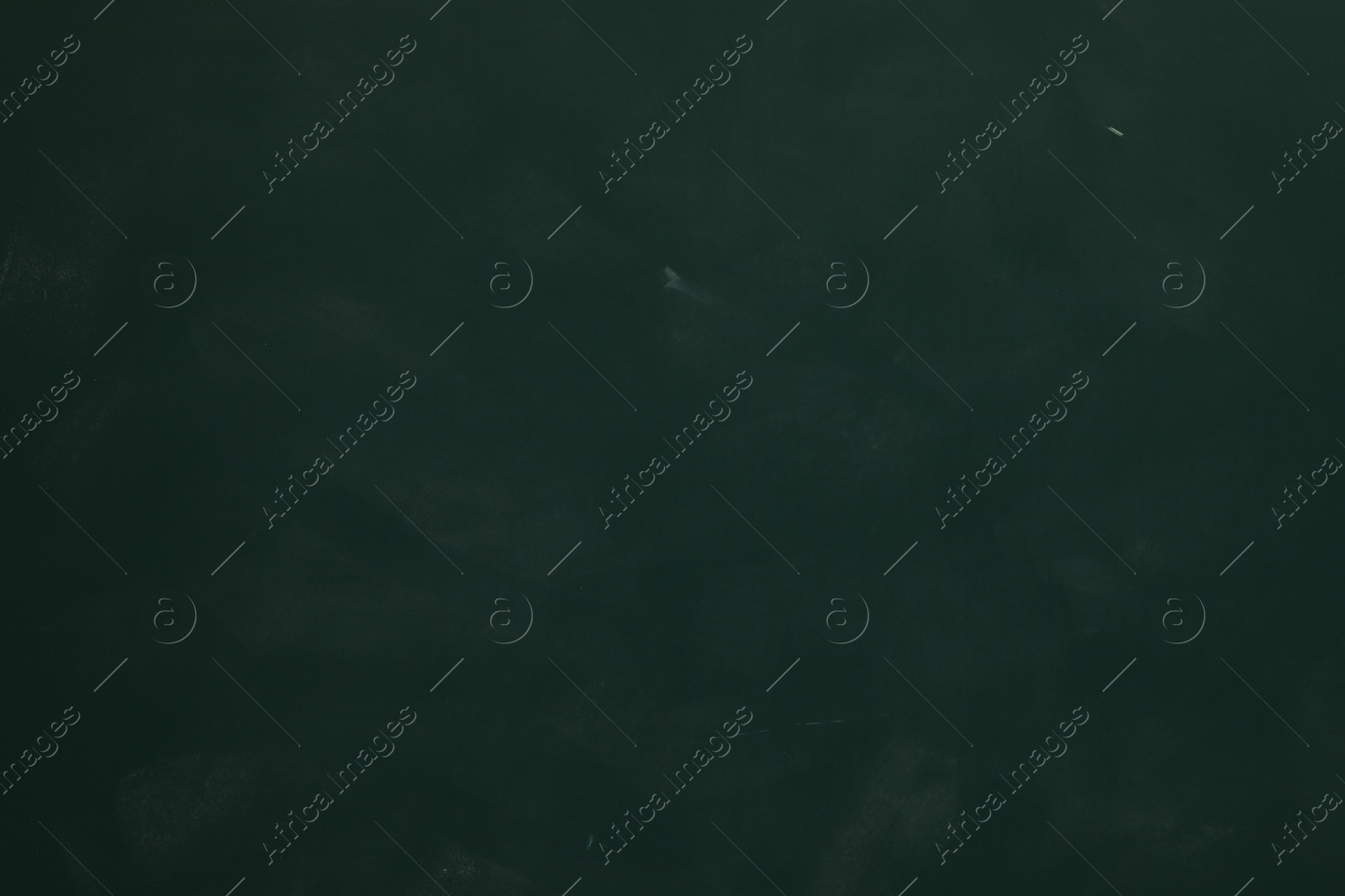 Photo of Chalk rubbed out on green chalkboard as background, closeup. Space for text