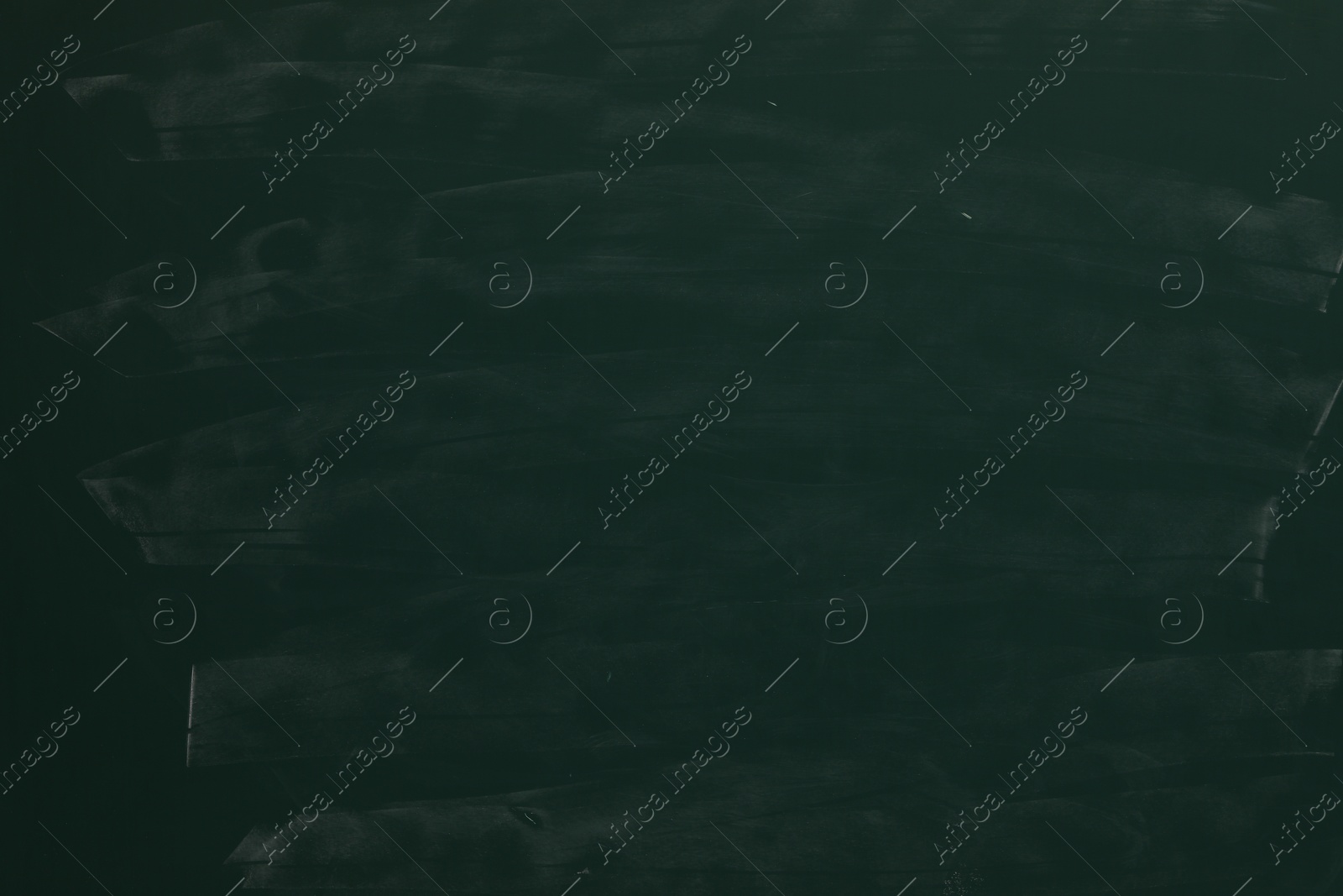 Chalk rubbed out on green chalkboard as background, closeup. Space for text Photo of Chalk rubbed out on green chalkboard as background, closeup. Space for text