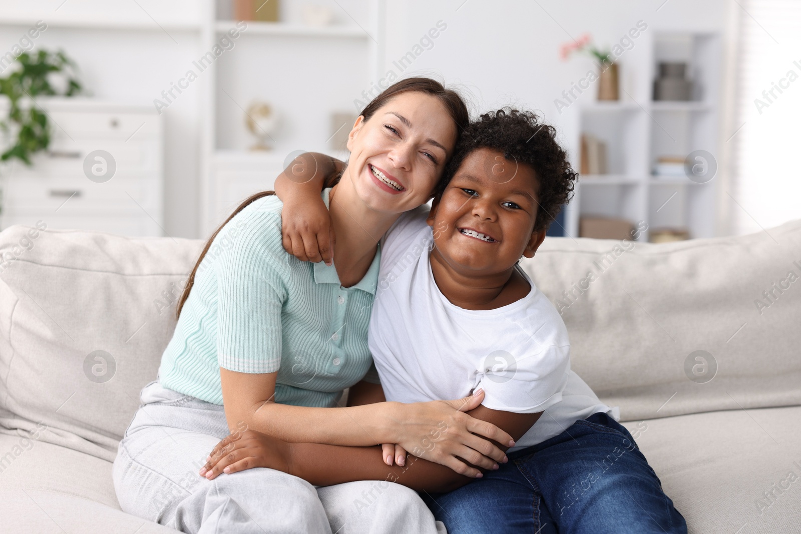 Photo of Adoption. Mother and her son at home