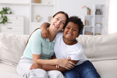 Photo of Adoption. Mother and her son at home